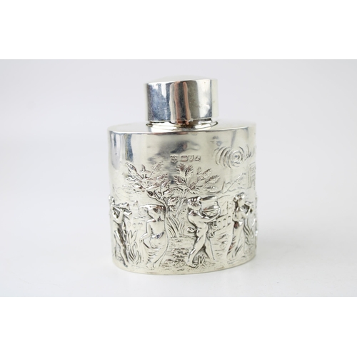 389 - Hallmarked silver tea caddy, Chester 1901, repousse decoration of traditional scenes, 105.4g.