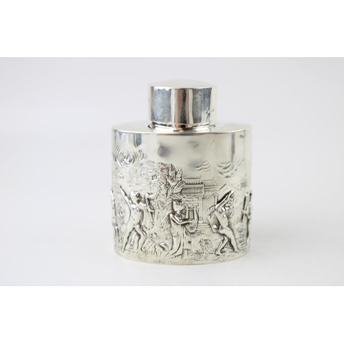 389 - Hallmarked silver tea caddy, Chester 1901, repousse decoration of traditional scenes, 105.4g.