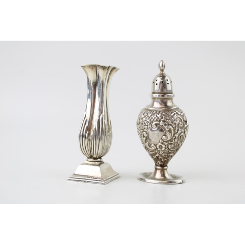 390 - Silver loaded vase, ornate form, Chester 1895, with a Silver pepperette, Birm 1899, total weight 90.... 