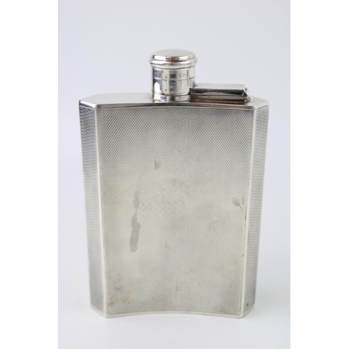 392 - Silver plated Art Deco hipflask, engine turned decoration, vacant cartouche, 14cm tall.