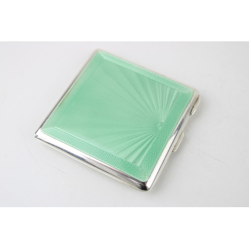 395 - Art Deco silver compact with green enamel decoration, Birmingham 1922, 90.0g.