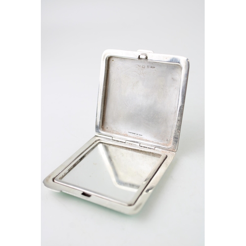 395 - Art Deco silver compact with green enamel decoration, Birmingham 1922, 90.0g.