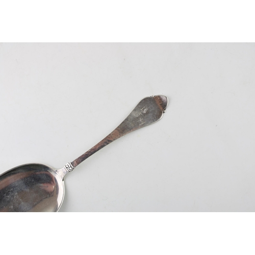 396 - Danish silver serving spoon, hallarked, 64.2g, 23.5cm long, hammered decoration, stamped 'Kragh'.