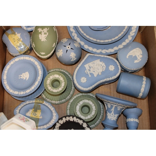 4 - A collection of Wedgwood Jasperware items to include vases, candle sticks, lidded pots, trinket tray... 