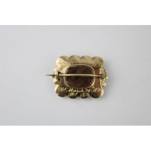 410 - A yellow metal (testing as gold) Victorian Mourning brooch, dated 1836 with inscription, 9.0g.