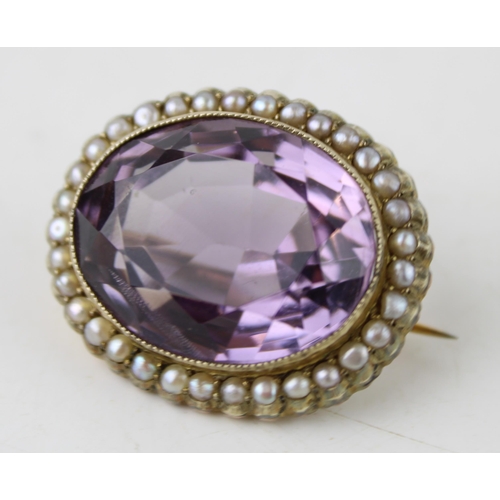 413 - Edwardian gold brooch, central amethyst surrounded by pearls, 13.0g, 3cm wide.