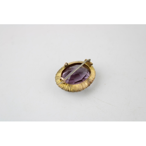 413 - Edwardian gold brooch, central amethyst surrounded by pearls, 13.0g, 3cm wide.