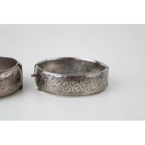 416 - Two silver bracelets, engraved decoration to the front, 86g (2).