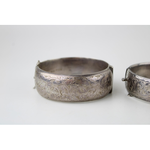 416 - Two silver bracelets, engraved decoration to the front, 86g (2).