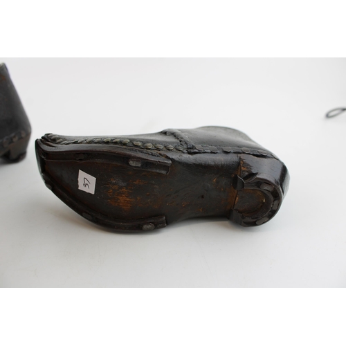 423 - A pair of Victorian leather and wooden clogs, suitable for children (2).