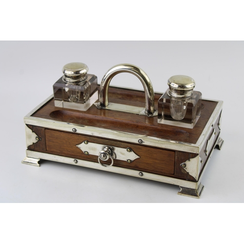 Edwardian ink stand with drawer, silver plated mounts and inkwells, 30cm wide.