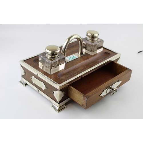 424 - Edwardian ink stand with drawer, silver plated mounts and inkwells, 30cm wide.