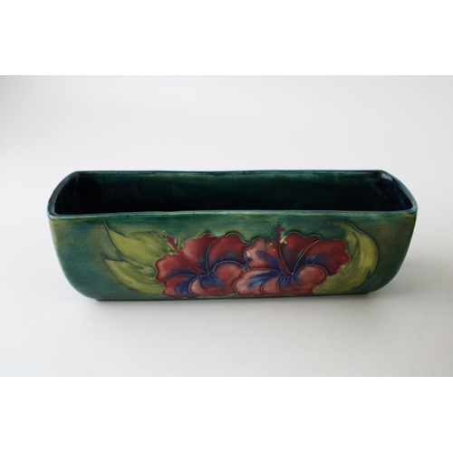 62 - A Moorcroft Hibiscus bowl with a rectangular dish, 21cm diameter (2 - both af).