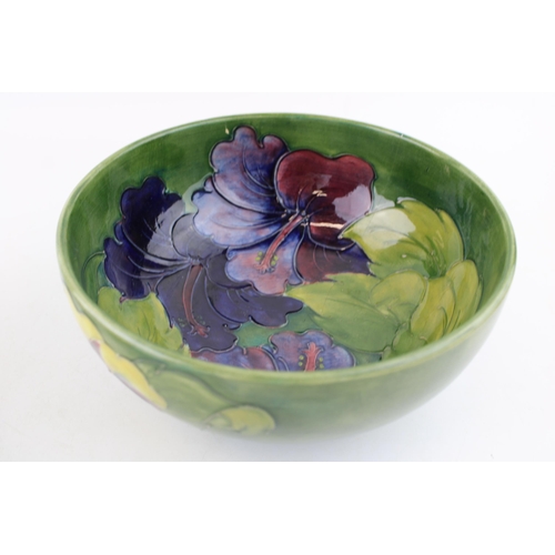 62 - A Moorcroft Hibiscus bowl with a rectangular dish, 21cm diameter (2 - both af).