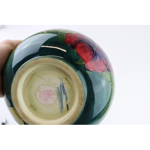 62 - A Moorcroft Hibiscus bowl with a rectangular dish, 21cm diameter (2 - both af).