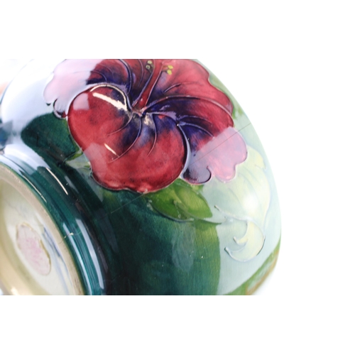 62 - A Moorcroft Hibiscus bowl with a rectangular dish, 21cm diameter (2 - both af).