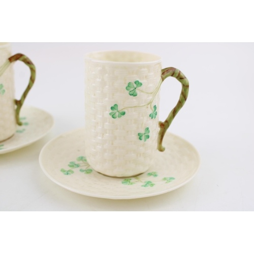 70 - A pair of Belleek cans in the Classic Shamrock pattern. (2) Height 11.5cm.