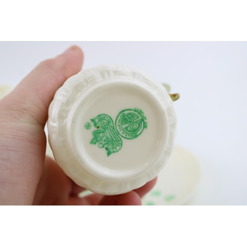 70 - A pair of Belleek cans in the Classic Shamrock pattern. (2) Height 11.5cm.