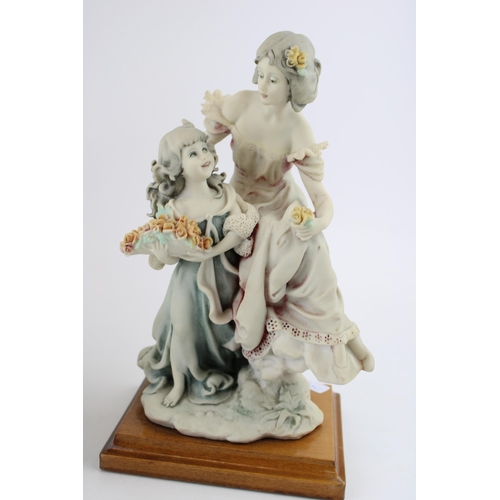 73 - A pair of Florence Giuseppe Armani Figurines to include a Mother and Daughter, with a similar figure... 