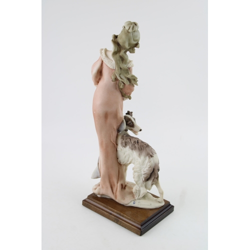 74 - Florence Giuseppe Armani Figurine of a lady with her dog, possibly a saluki, on wooden base, 36cm ta... 