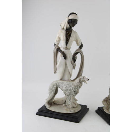 78 - Two Florence Giuseppe Armani Figurines of a lady with a dog and one similar (2), tallest 40.5cm.