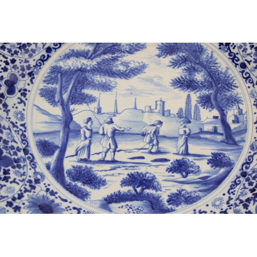 86 - Large Delft pottery charger, 39cm diameter, markings to verso.