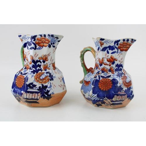 98 - A pair of early 19th century Mason's Ironstone Japan Pattern Hydra Jugs. Height 16.5cm.