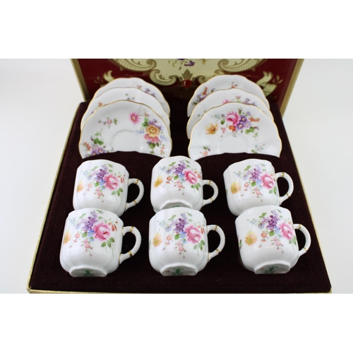 117 - Boxed Royal Crown Derby 'Derby Posies' to include 6 cups and 6 saucers (12).