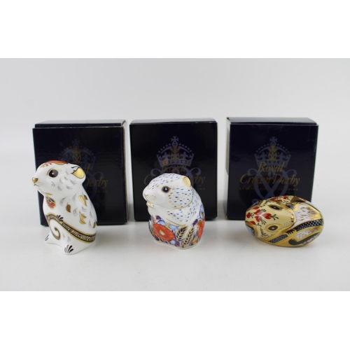 136 - Three Royal Crown Derby paperweights, Mouse, gold stopper and red Royal Crown Derby stamp on the bas... 