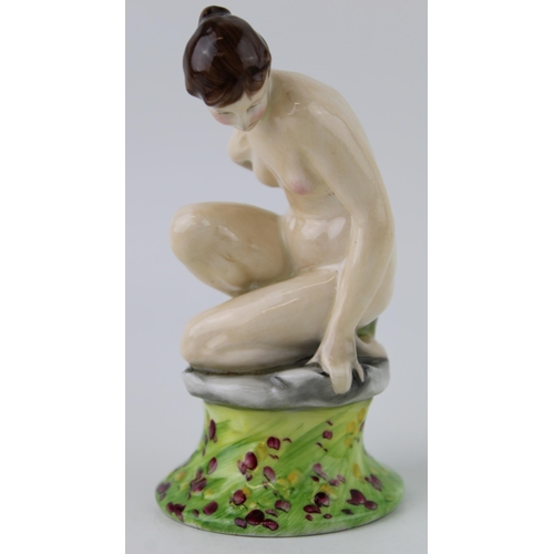 141 - Royal Doulton figure of a crouching female nude, printed marks and impressed numbers to base, height... 