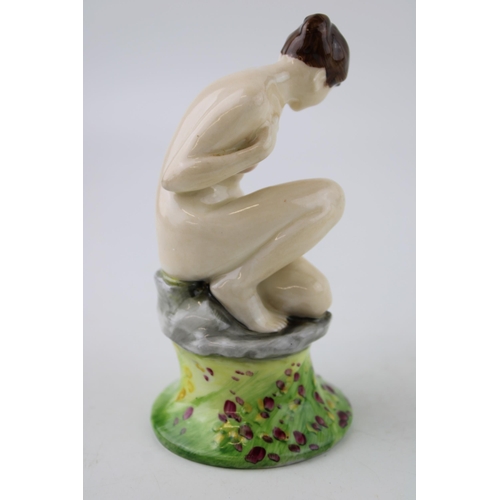 141 - Royal Doulton figure of a crouching female nude, printed marks and impressed numbers to base, height... 