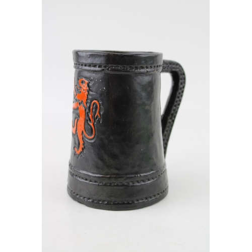 162 - Royal Doulton Lambeth leather effect tankard with Rampart Lion crest, 13.5cm tall.