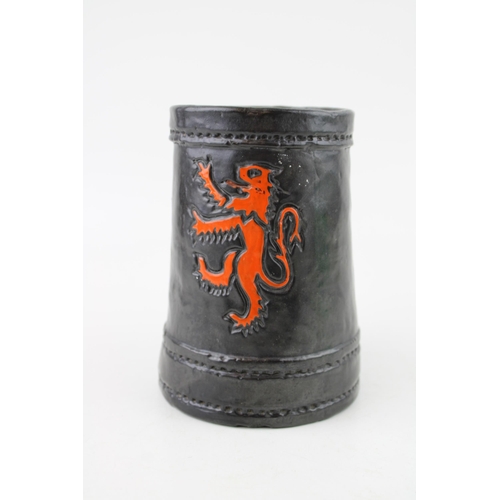 162 - Royal Doulton Lambeth leather effect tankard with Rampart Lion crest, 13.5cm tall.