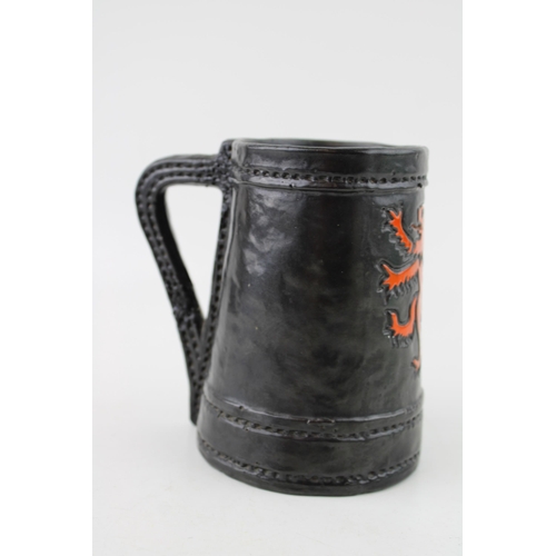 162 - Royal Doulton Lambeth leather effect tankard with Rampart Lion crest, 13.5cm tall.