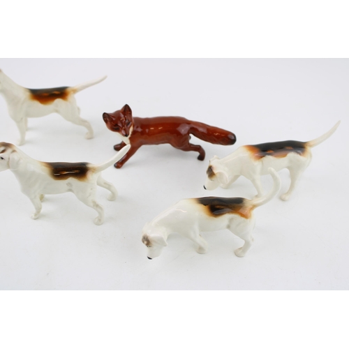 2 - A collection of Beswick to include four foxhounds and a fox (5).