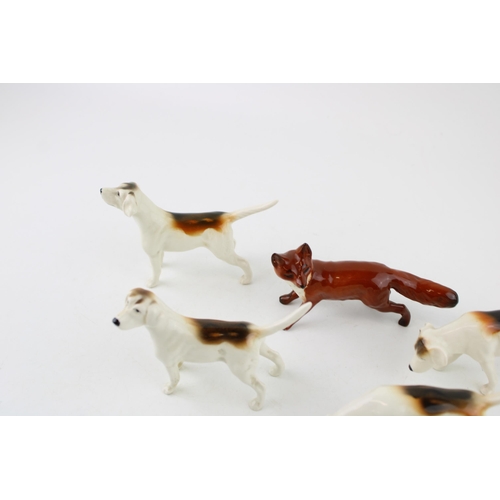 2 - A collection of Beswick to include four foxhounds and a fox (5).