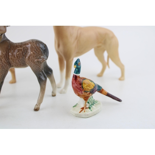 22 - Beswick to include two Jovial Roger greyhounds, a comical donkey foal, a goat and a pheasant (5).