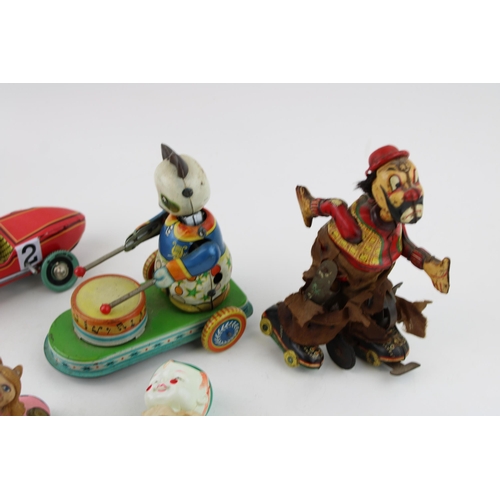 442 - A collection of vintage clockwork tin toys to include Hobo clown (Japan) , Celuloid tumbling toy (Ja... 