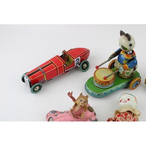 442 - A collection of vintage clockwork tin toys to include Hobo clown (Japan) , Celuloid tumbling toy (Ja... 