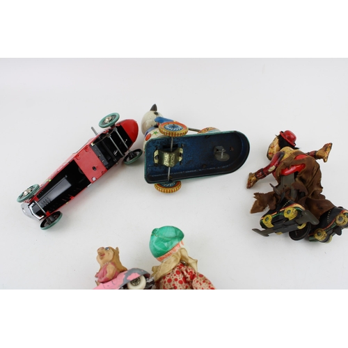 442 - A collection of vintage clockwork tin toys to include Hobo clown (Japan) , Celuloid tumbling toy (Ja... 