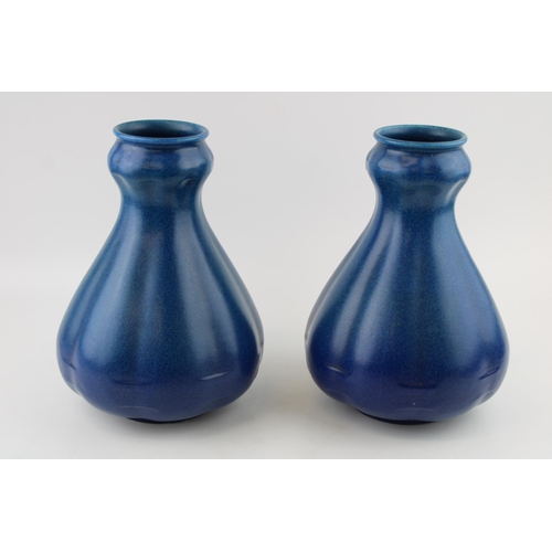 47 - A large pair of Royal Lancastrian vases, mottled blue decoration, shaped, 25.5cm tall (2).