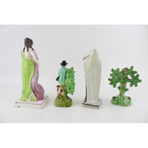 50 - Four early 19th century Staffordshire figures to include a bocage figure of a nude boy 'Salt' to ver... 