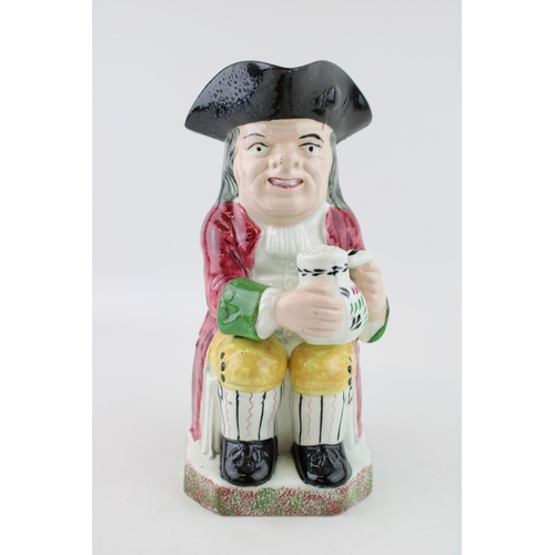 51 - Davenport Toby jug, decorated in Portobello type colours with a red jacket over yellow breeches, the... 