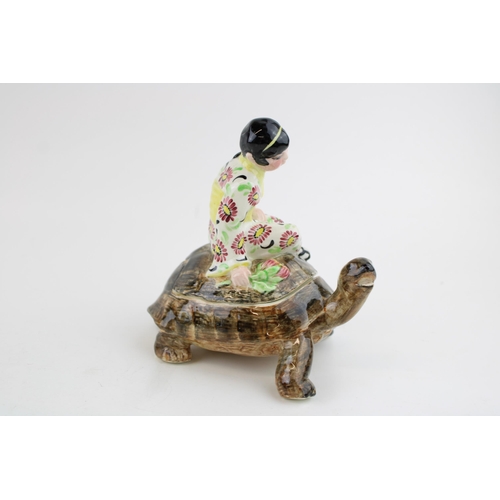 58 - Goldscheider trinket box in the form of a Japanese Geisha Girl sitting on a turtle, printed marks 'G... 