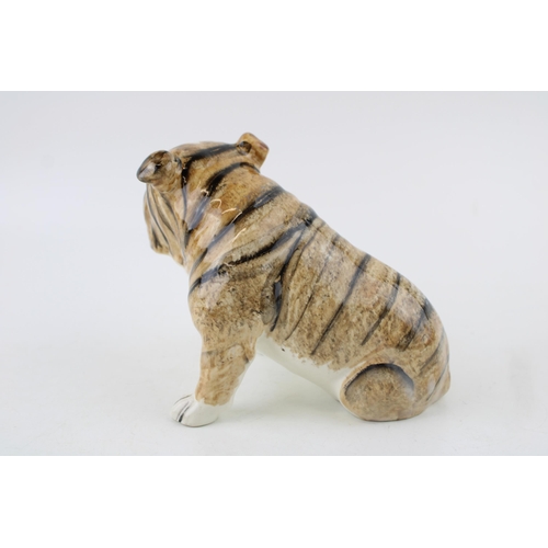 59 - Goldscheider pottery figure of a bulldog, printed marks and initialled 'RB', 15.5cm long.