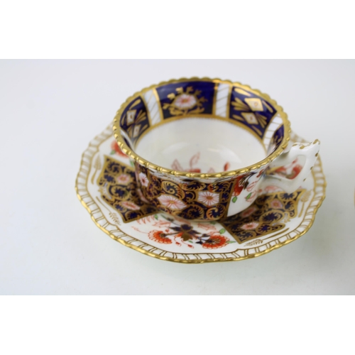 65 - A Coalport cup and saucer, imari style decoration, circa 1895, with an unmarked cup and saucer, John... 