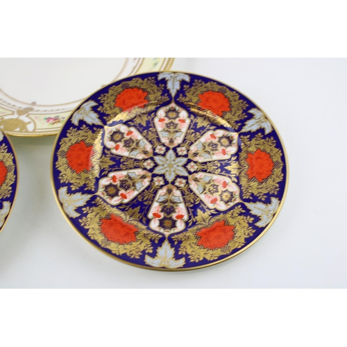 68 - A near pair of Lynton Derby Imari plates, circa 21cm diameter, with a restored Minton jewelled cabin... 