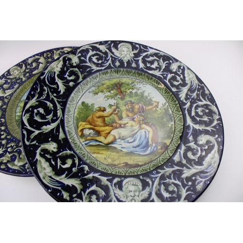 75 - A pair of 19th Century Italian Faience ware chargers, in the manner of Cantagalli, each with a mythi... 