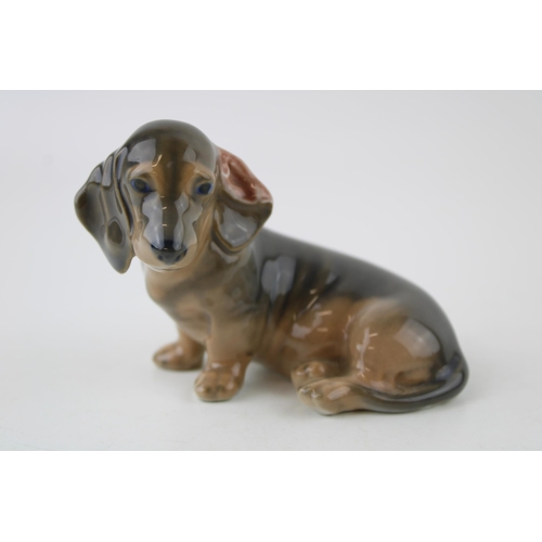 79 - Royal Copenhagen model of a seated Daschund lopped ear puppy figurine 3140.