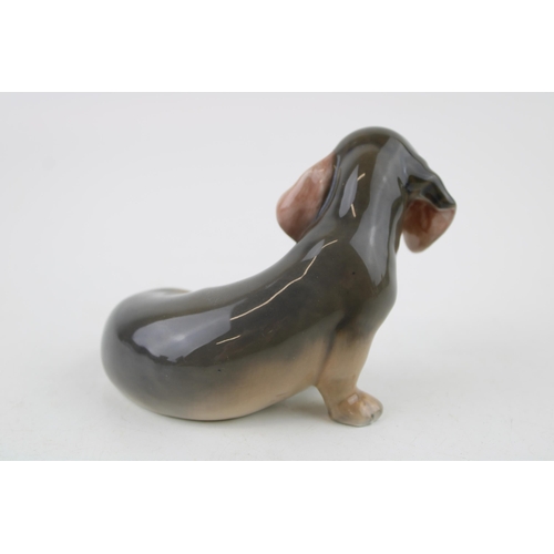 79 - Royal Copenhagen model of a seated Daschund lopped ear puppy figurine 3140.